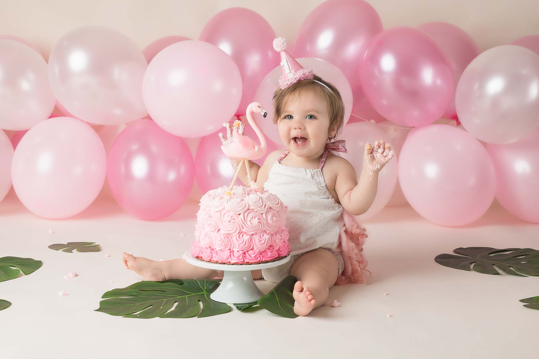 Little girl flamingo theme cake smash pink balloons